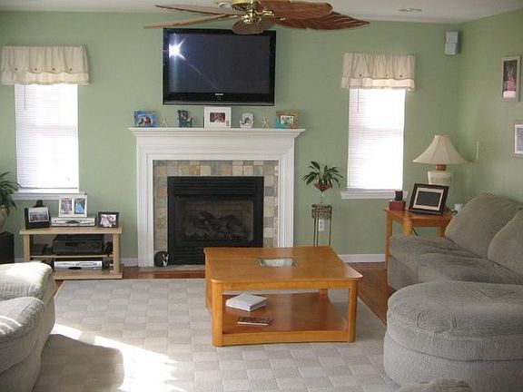 good sized family room w/ fireplace and sliders to large deck