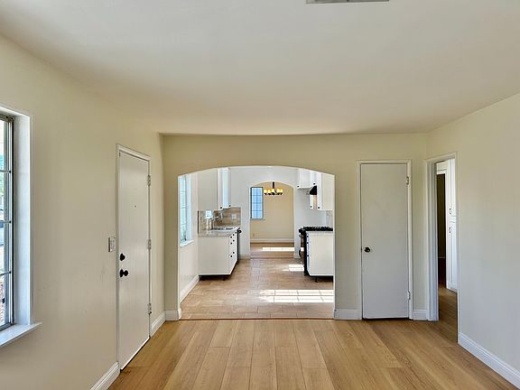view from living room through kitchen to dining room