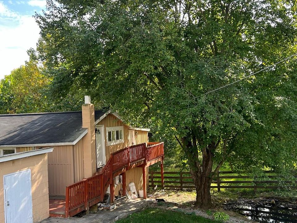 This the front door to the unit showing deck and patio area