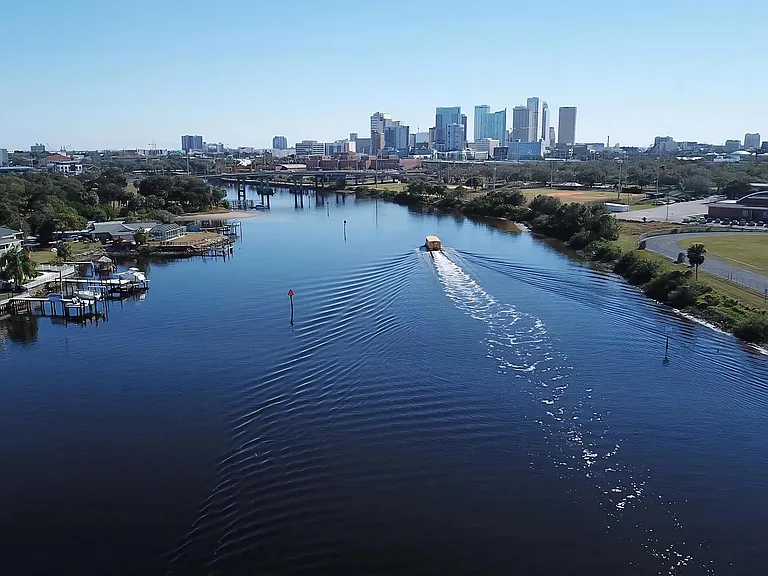 View of Downtown Tampa from the River with Water Taxi Near Anchor Riverwalk