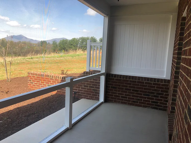 Screened in back porch with unobstructed views
