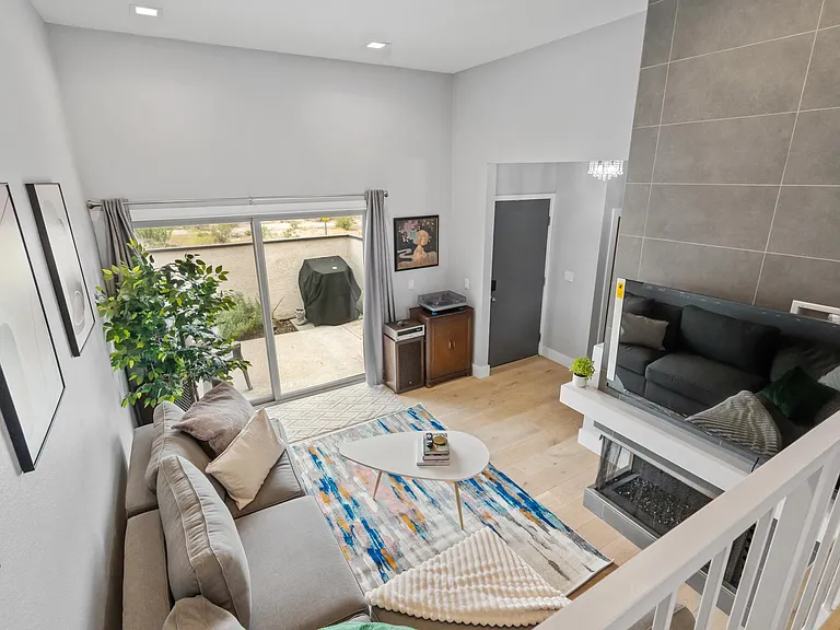 Natural light floods through the windows, framing panoramic views.