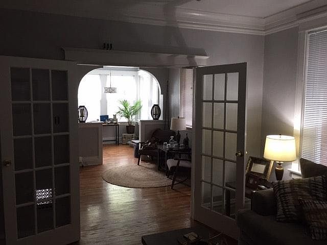 Photo taken from dining room through living room to sunroom.