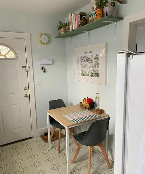 Kitchen with stack washer dryer to the left of the front door