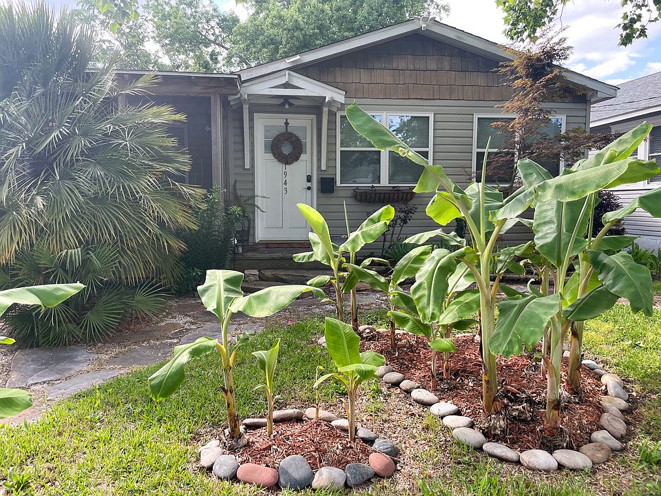 Front of House - established banana trees to greet you in the morning (dedicated front yard parking slab to left of trees, not seen)