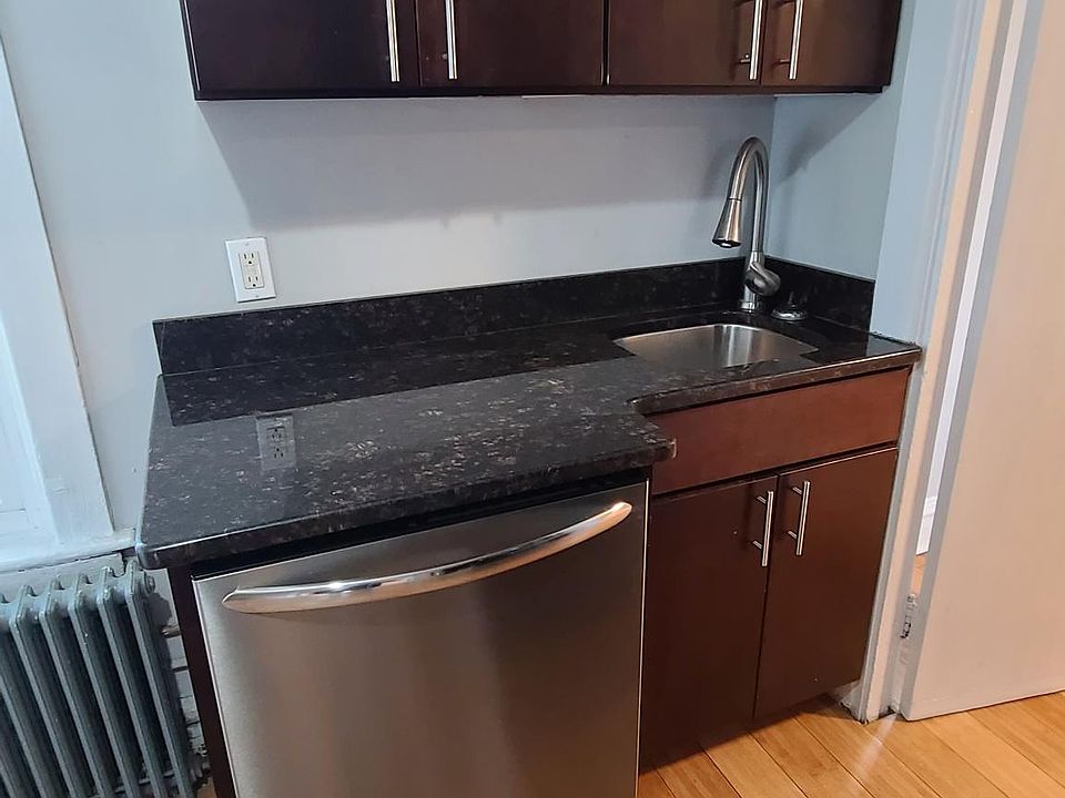 Kitchen with granite counters, stainless steel appliances and dishwasher