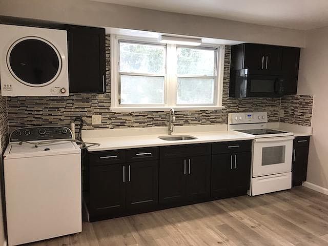 New kitcken with brand new hardwood floor.