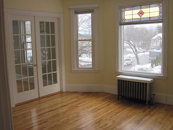 dining room with view of stained glass bay window and french