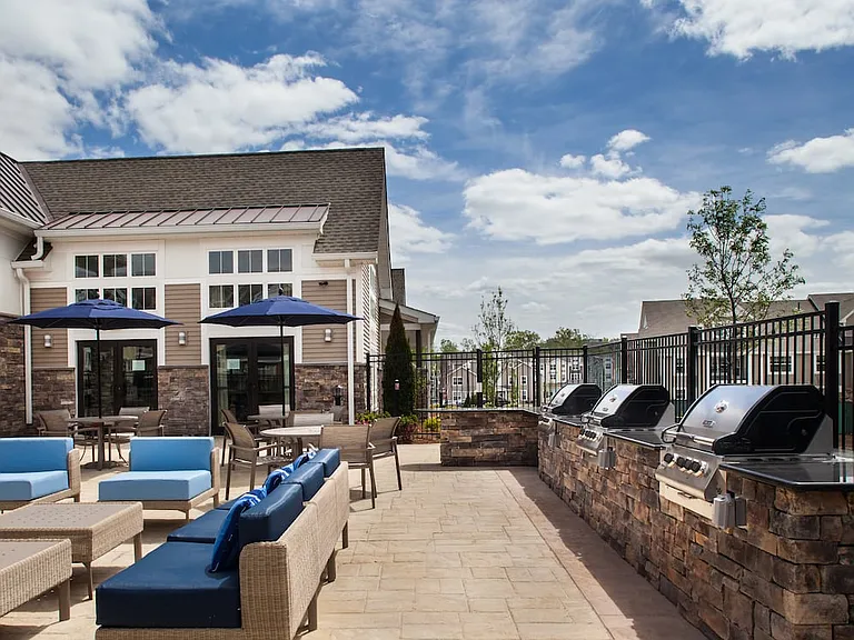 Phase II Outdoor lounge with firepit and grills