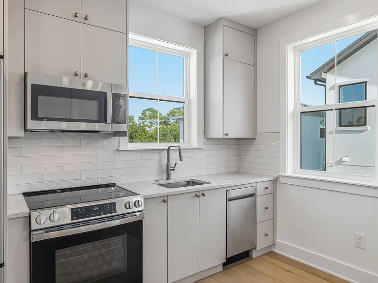 Kitchen with brand new appliances- fridge/freezer, microwave, oven, stove, dishwasher, garbage disposal