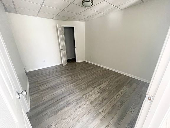 bedroom with walk-in closet and built-in shelves