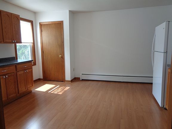 Another view of eat-in-kitchen showing the large pantry closet. Freshly painted last year. No additional wall mounted shelves/rods/hooks allowed.
