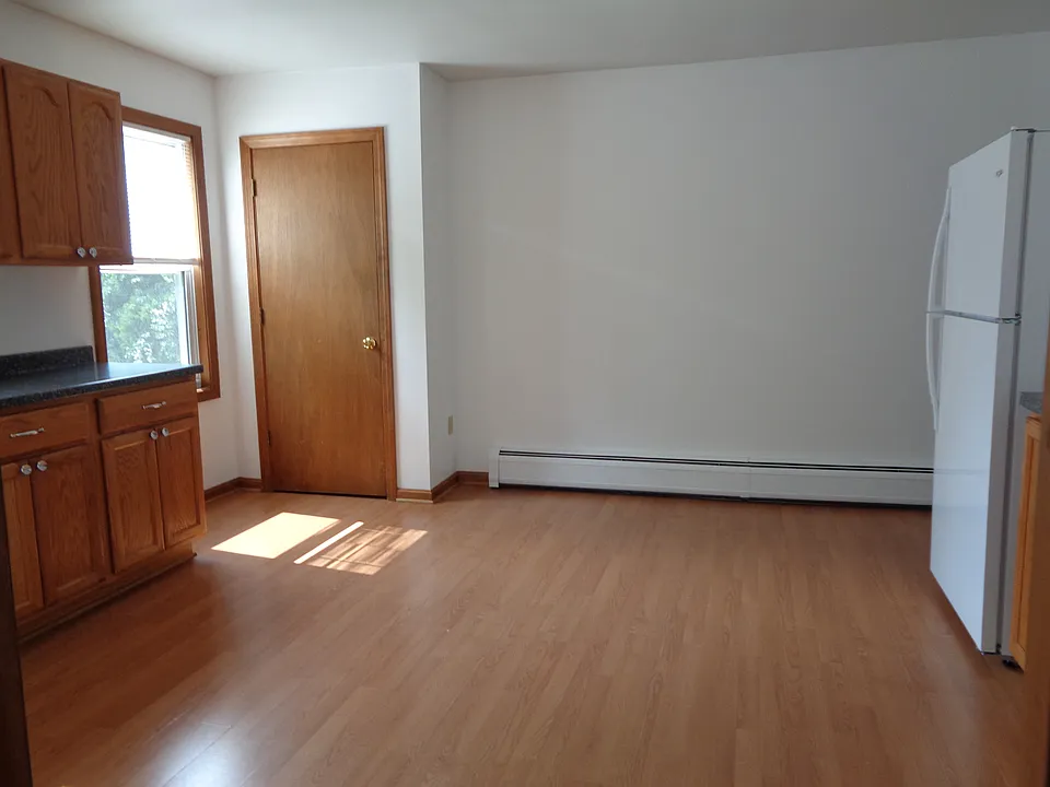 Another view of eat-in-kitchen showing the large pantry closet. Freshly painted last year. No additional wall mounted shelves/rods/hooks allowed.