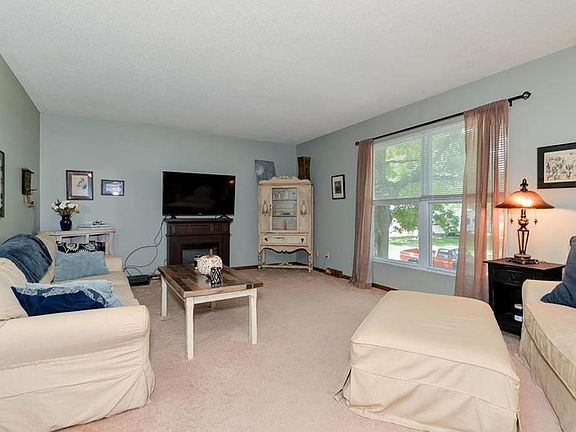 Large Windows Light Up This Cozy Living Room