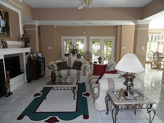 View of family room from entry, to the right is open to large island kitchen with breakfast bar