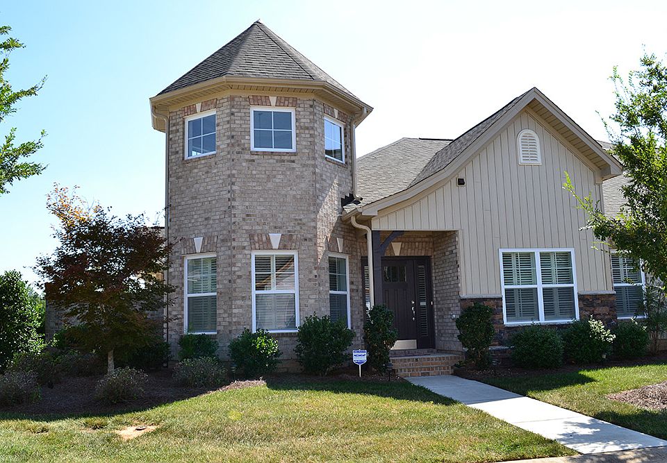 This two-story townhome features a large master su