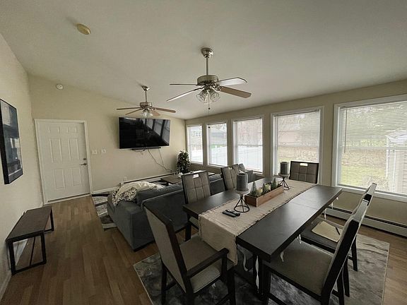 Spacious sunroom with complete privacy to back of the house.