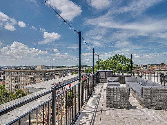 Rooftop deck with seating and lounge area