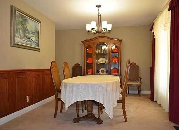 Beautiful wooden chair-height accent wall and lots of light!