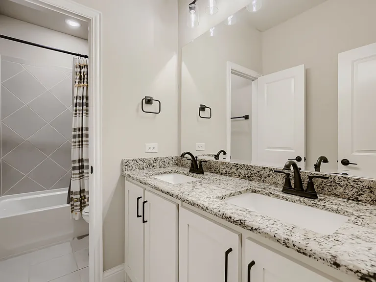 Double vanity with granite countertop and undermount sinks
