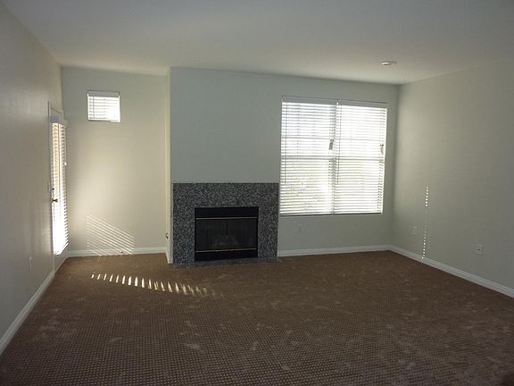 Large living room with fireplace.