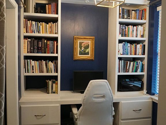 Front office space with built-in desk and shelving