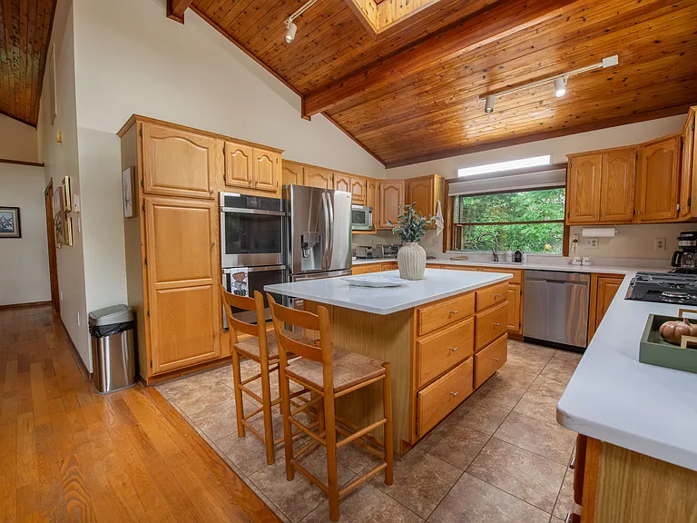 Kitchen with new digital fridge and double oven.