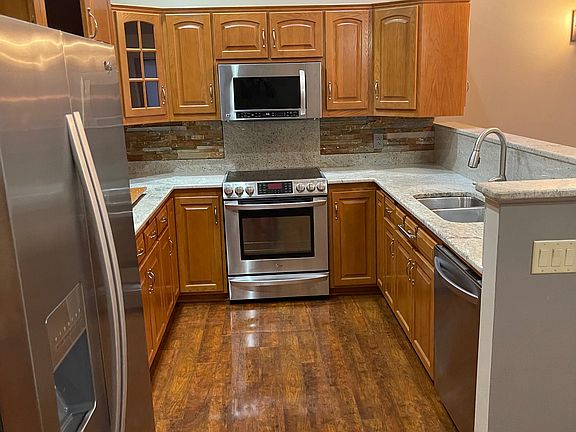 Kitchen with all stainless steel appliances.