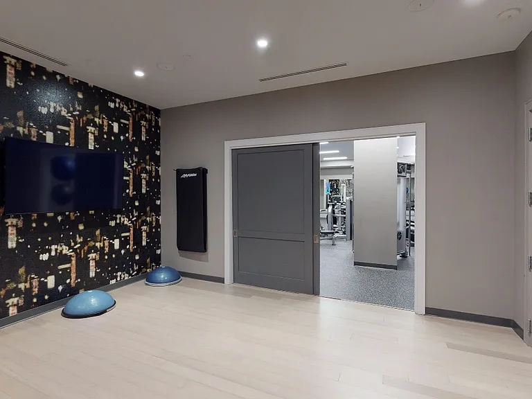 Club-quality fitness studio featuring a group fitness area and yoga/Pilates studio