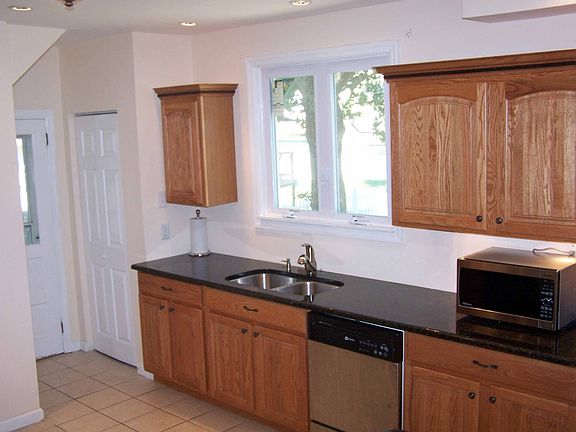 Raised Panel (Oak) Cabinetry & Ceramic Floor