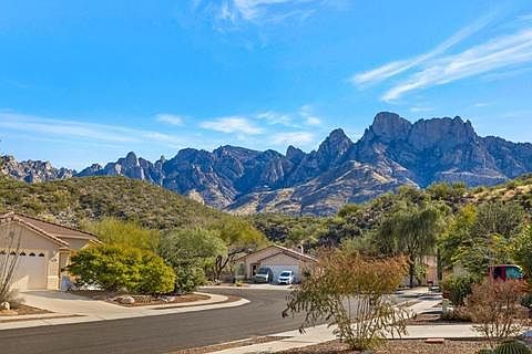 View from the driveway, not much separating you from nature here! Hike out of the back or front of the fenced in property whenever you'd like. The Romero Pools House is located on a quiet cul-de-sac.