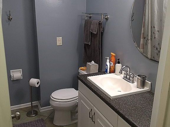 Full bath with tile floor