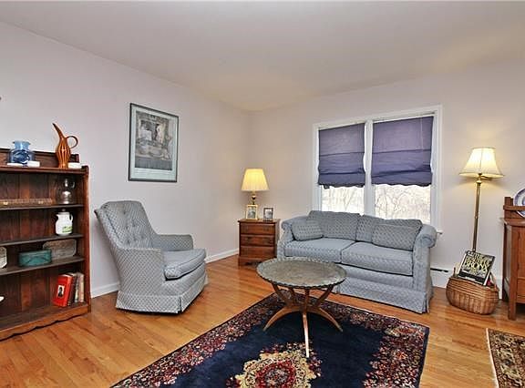 Living room with hardwood flooring.