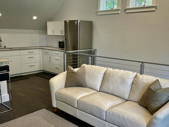 Close up of couch and kitchen