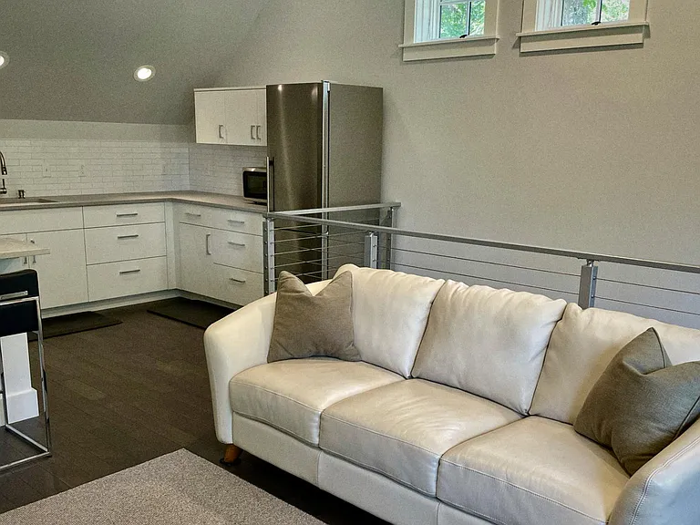 Close up of couch and kitchen