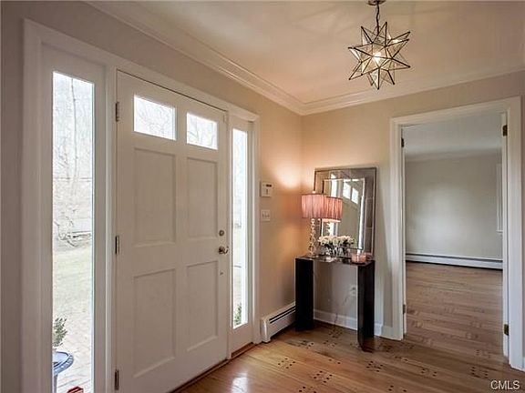 Lovely foyer opens to formal Living and Dining rooms