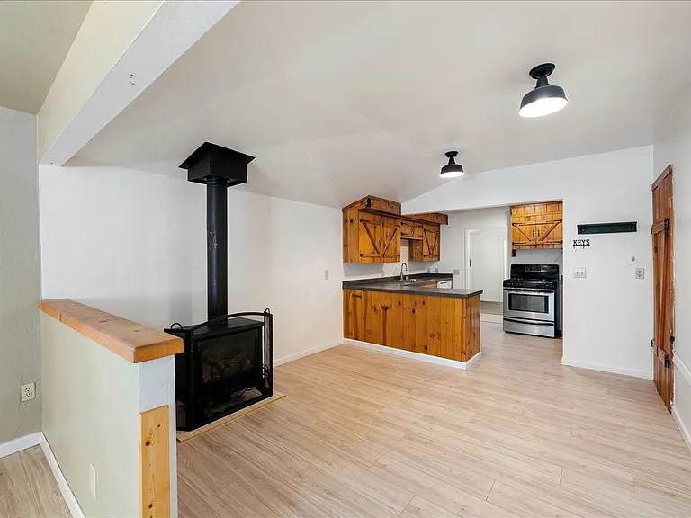 Propane stove for main living area heating