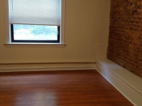 Living room with exposed brick wall