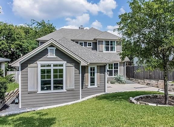 Yard has both sodded and xeriscaped attributes for easy maintenance.