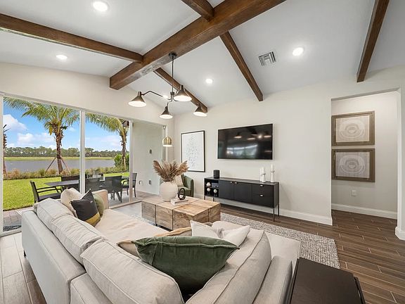 Great room with stained ceiling beams