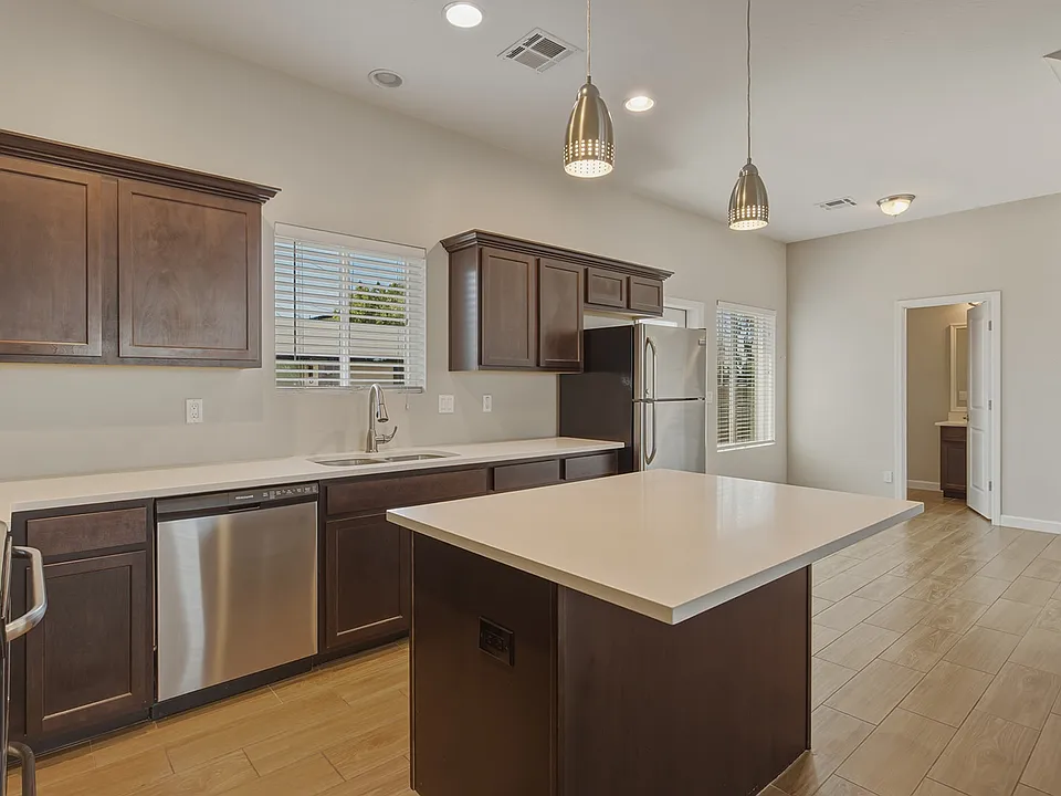 Open kitchen with an island, plenty of counter space and cabinet storage