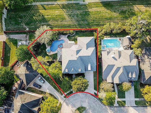 Nothing but green space behind this gorgeous 5 bedroom home created by Village Builders!