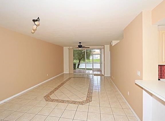 Great Room - Living/Dining . Tile with very lovely inlay as shown.