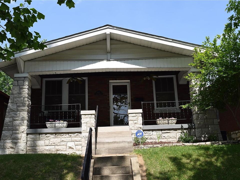 A close up of the home, catch a breeze with the two front porch ceiling fans, and enjoy city living at its best!