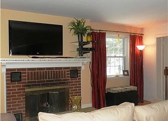 Living Room with Brick Gas Fireplace