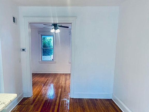 Gleaming hardwood floors join the dining room to the living room.