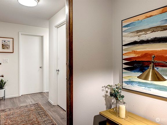 Step into this Magnolia condominium and you'll immediately notice the spacious landing that greets you before you even enter the home. This large landing creates an open and inviting feel, providing a warm welcome for you and your guests. It's the perfect spot to take off your shoes, hang your coat, and settle in for a relaxing evening. You'll appreciate the added sense of space and openness that this feature brings to the home.>