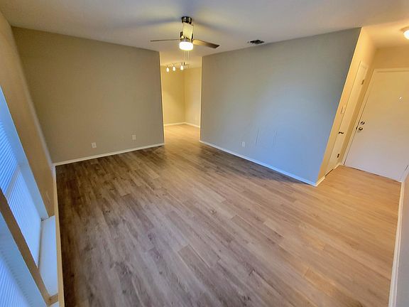 Living room with entry to apartment on right