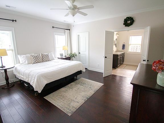 master bedroom (shown here with king bed) with walk-in closet and en-suite bath