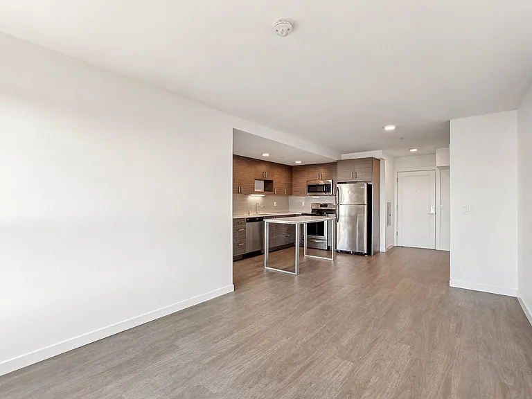 Discover a contemporary open-concept apartment at 4400 Alaska in Seattle, WA, featuring a modern kitchen with stainless steel appliances and spacious living ...